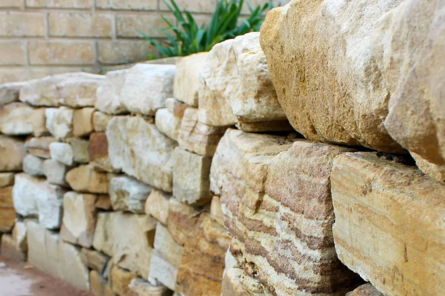 Close-up of natural sandstone block retaining wall