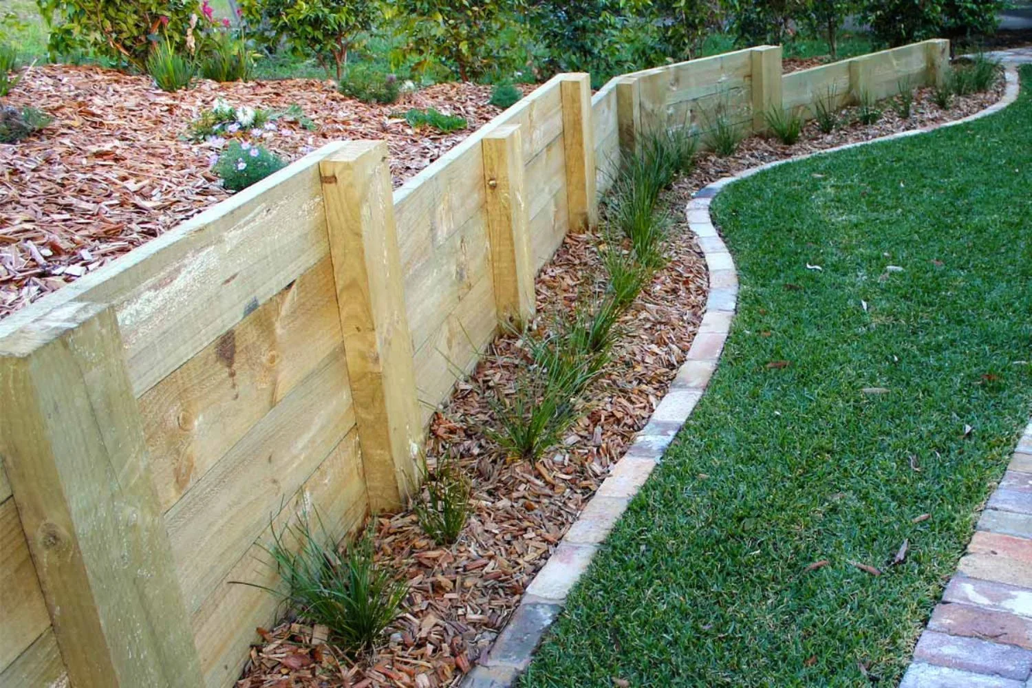 Timber sleeper retaining wall on a sloped street-facing property